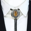 Western Cowboy Bolo Tie Necklace with a stone centerpiece on a white shirt and black jacket