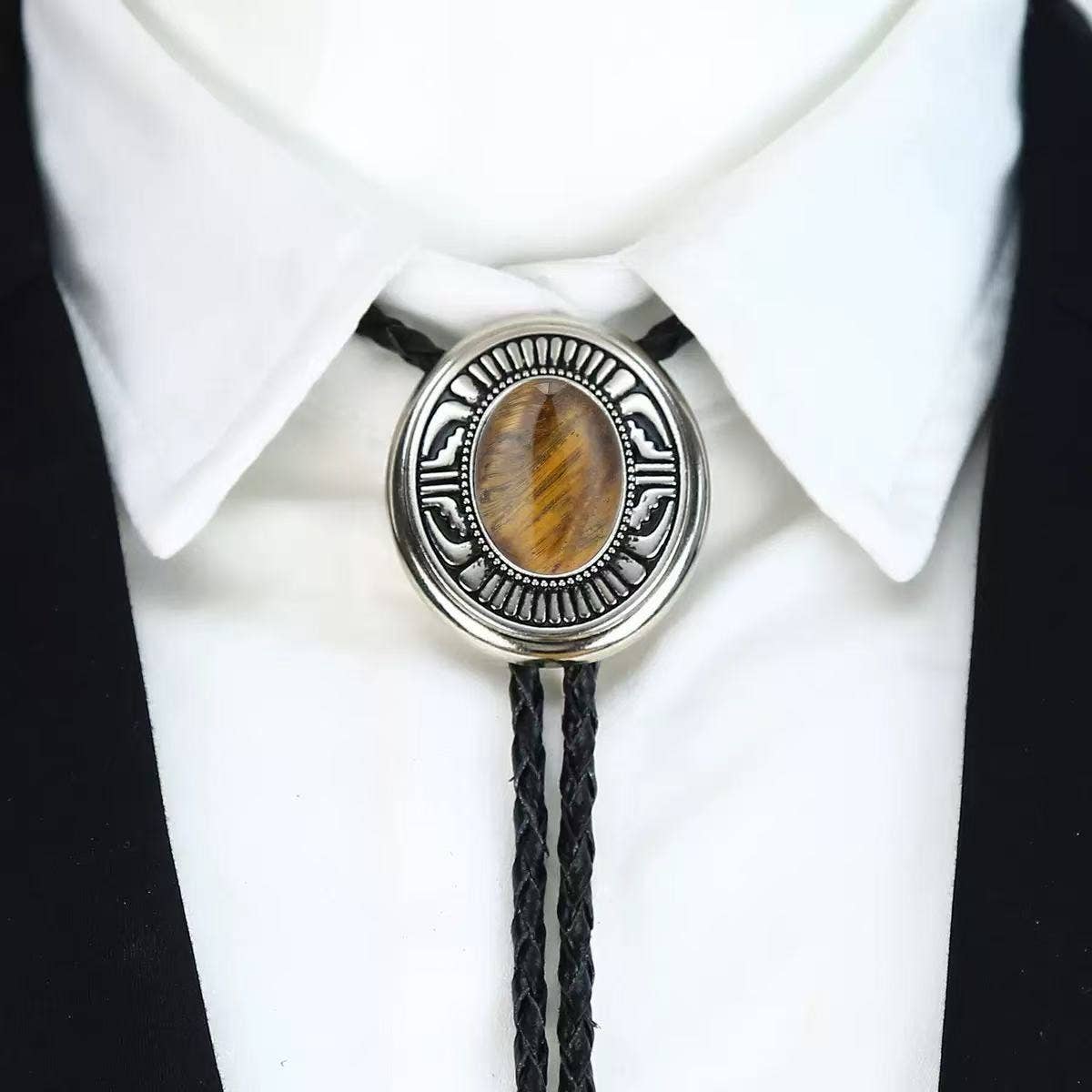Western Cowboy Bolo Tie Necklace with a stone centerpiece on a white shirt and black jacket