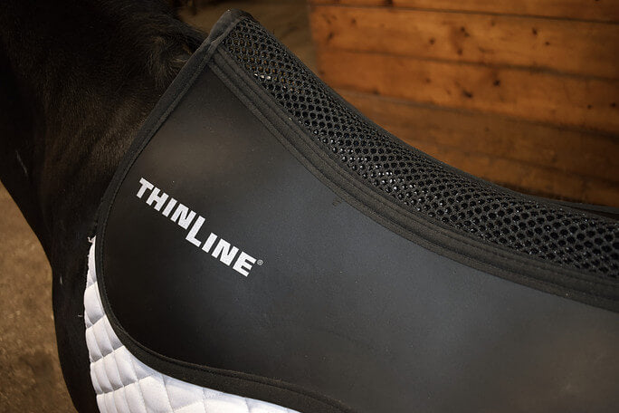 Close-up of a black ThinLine Perfect Fit Protection Half Pad - (3/16”)