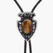 Western Cowboy Bolo Tie Necklace with tiger's eye stone and silver detailing on a white background
