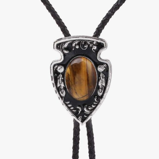 Western Cowboy Bolo Tie Necklace with tiger's eye stone and silver detailing on a white background