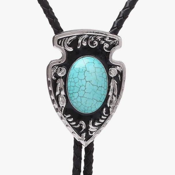 Turquoise stone on a Western Cowboy Bolo Tie Necklace with silver detailing on a white background