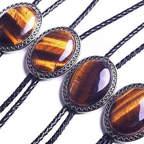 Four bolo ties with tiger eye stone and braided design on a white background