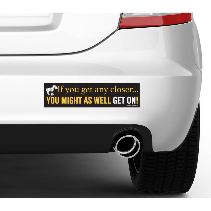 Car bumper with a humorous Bumper Sticker: Any Closer...Get On!