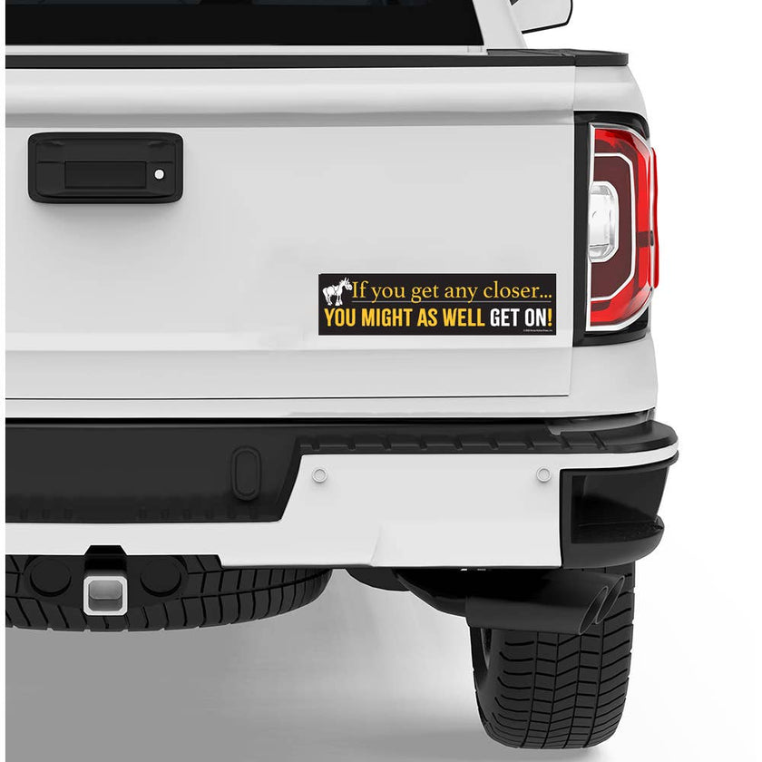 White truck with a humorous Bumper Sticker: Any Closer...Get On!