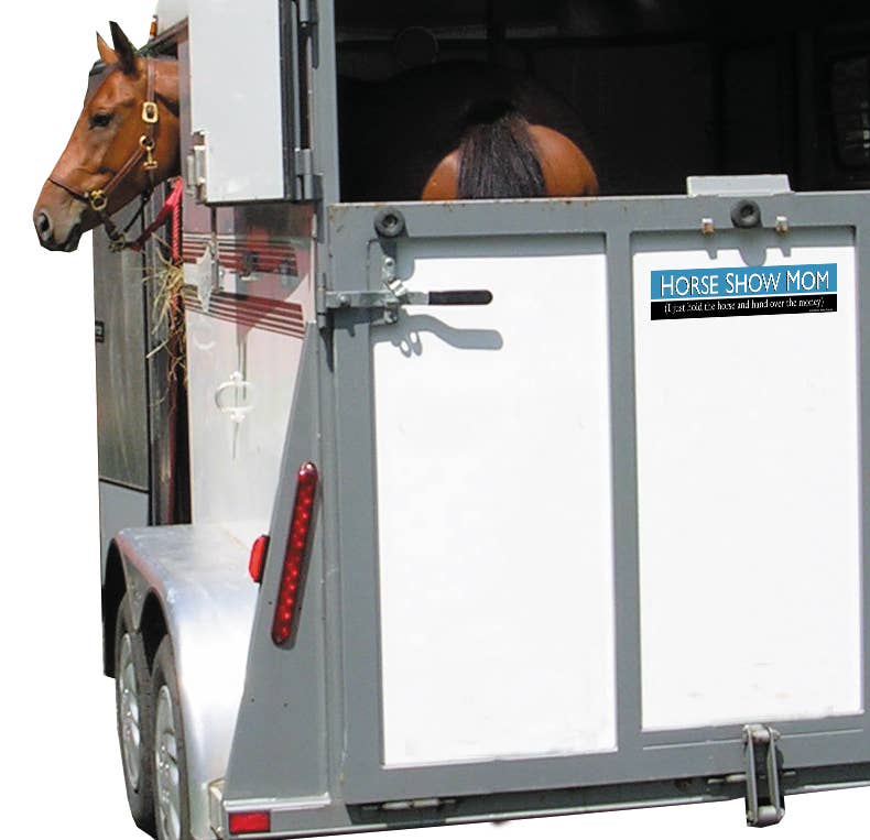 Horse in a trailer with a visible 'Horse Show Mom' Bumper Sticker.