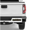 White truck with a humorous Bumper Sticker: Retired! Just Horsin' Around!