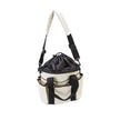 Canvas Drawstring Grooming Tote closed showing shoulder strap and short handle