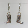 Silver cowboy boot earrings on a white background
