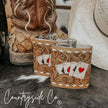 Handcrafted Leather Flask Stainless Steel with playing card design on a rustic surface, featuring 'Countryside Co' branding.