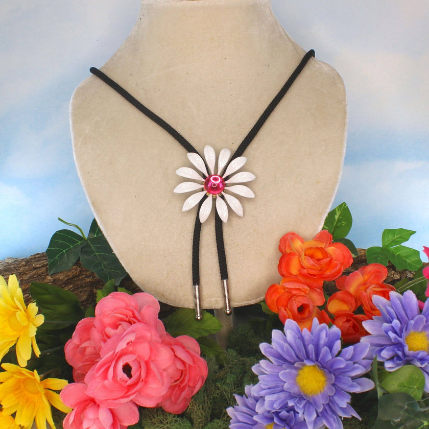 HHH Designs - 59mm White Enamel Daisy Bolo Tie With Pink Stone on display