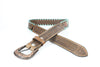 Brown leather belt with intricate design on a white background