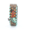 Decorative leather wallet with tribal patterns on a white background