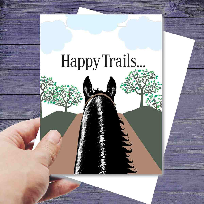 Horse Birthday Card: Happy Trails with a horse illustration and 'Happy Trails' text on a wooden surface