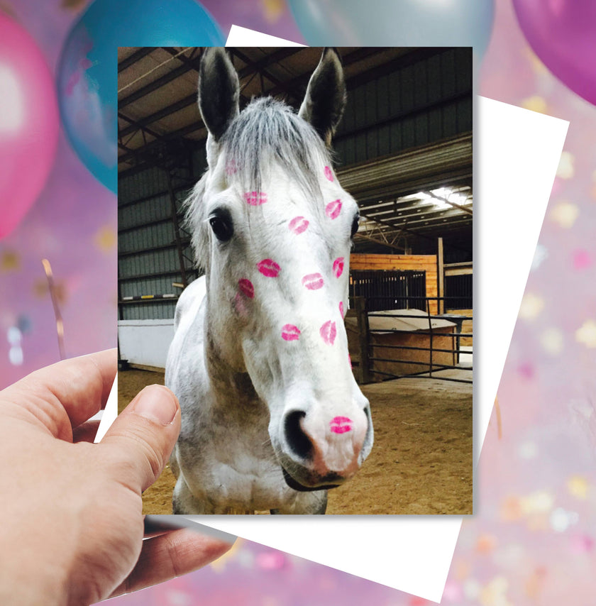 Horse Birthday Card: Horse Kiss Horse with pink kisses on a blurred background