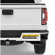White truck with a humorous bumper sticker on the rear as example