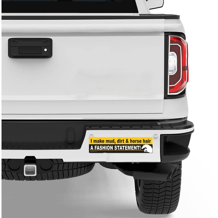 White truck with a humorous bumper sticker on the rear as example