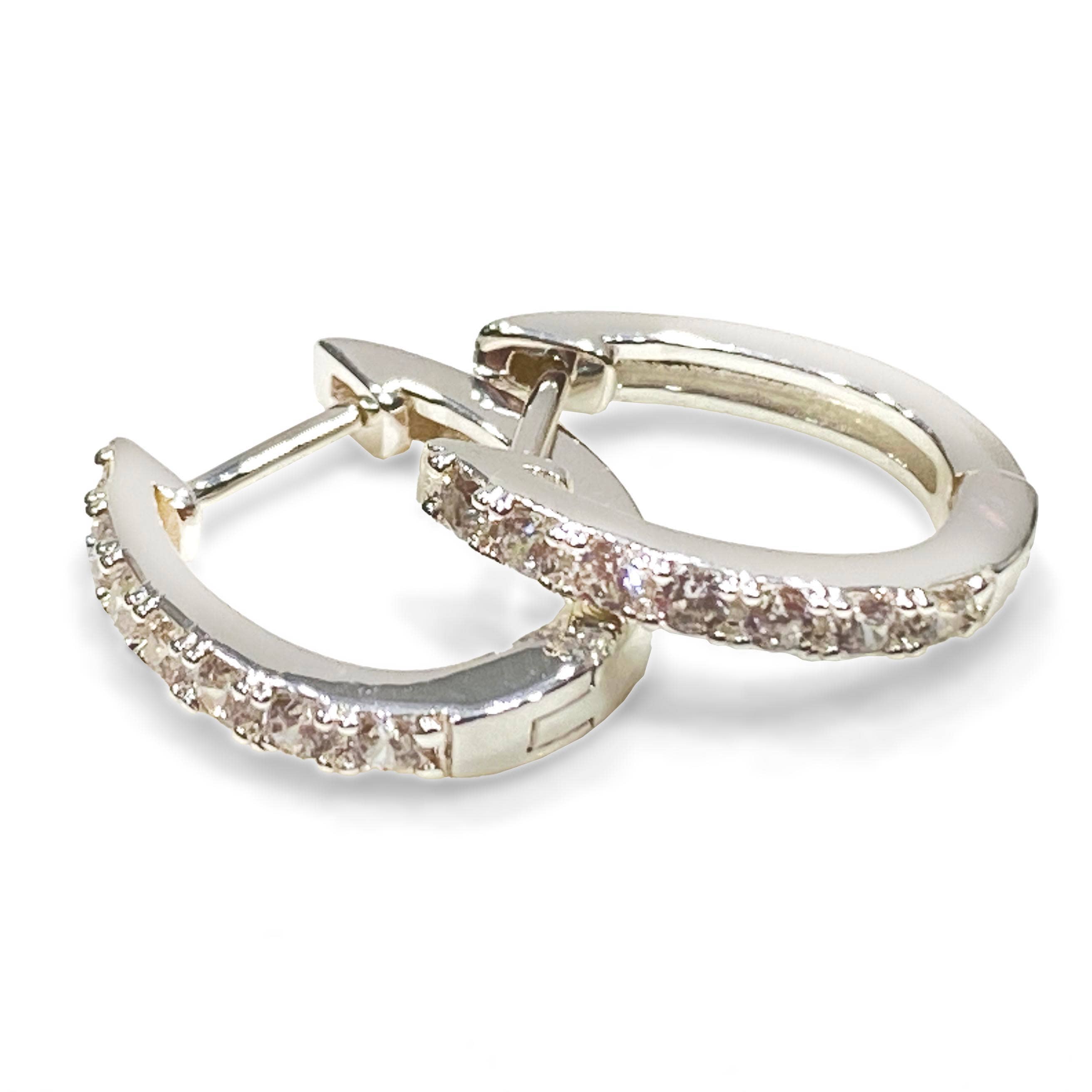 Horseshoe Hinge Earrings CZ Stones - Silver hoop earrings with glittery detailing on a white background