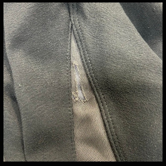 Close-up of KHS-E Kids L Irideon Tights with tear