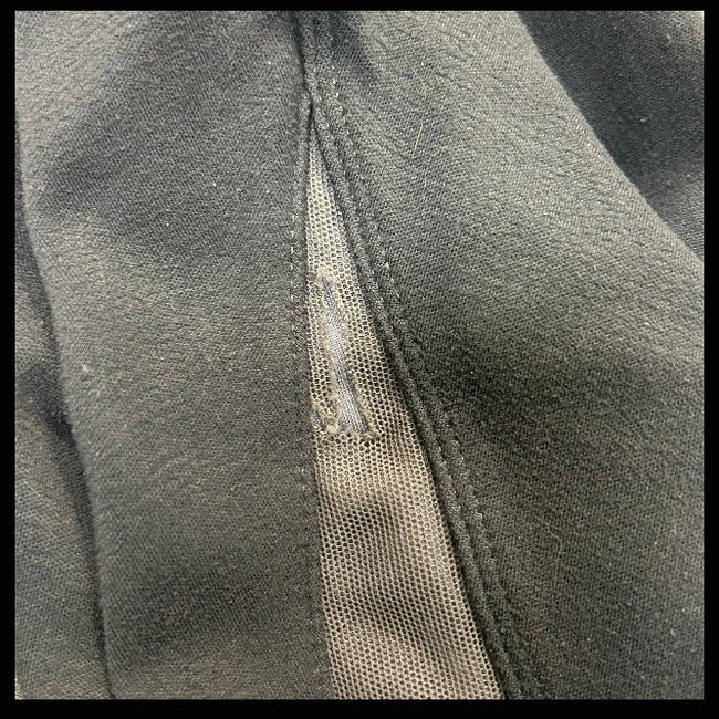 Close-up of KHS-E Kids L Irideon Tights with tear