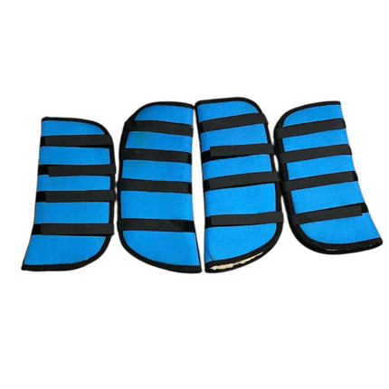 Four blue KHS-E Pony Shipping Boots with black velcro 