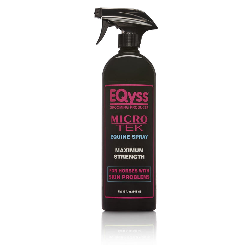 A black spray bottle labeled EQyss Micro-Tek Equine Spray with pink and white text, indicating it is a maximum strength product for horses with skin problems.