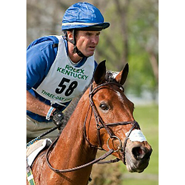 Jockey on a horse with Nunn Finer Flair Nasal Strips as example use on horse's nose.