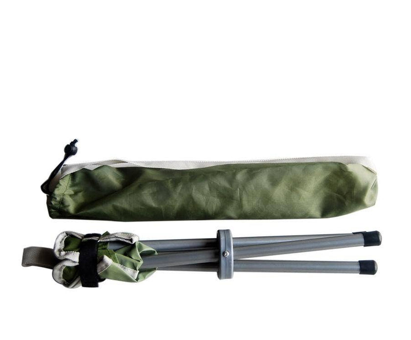 Folded Camping stool with green carrying bag on a white background