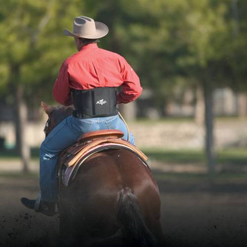 Professionals Choice Comfort-Fit Low Back Support shown on rider on horse