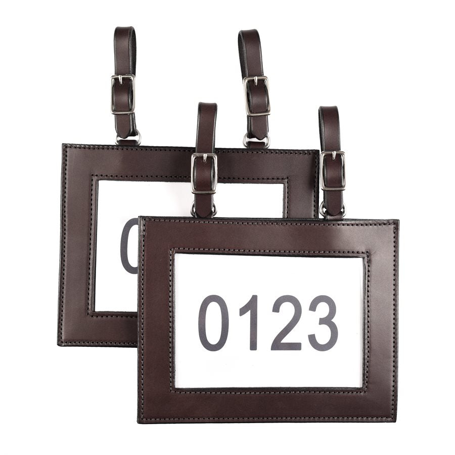 Ranch Leather Number Holders shown and sold as a pair in brown leather with two buckles on each for attaching to your saddle or tack.