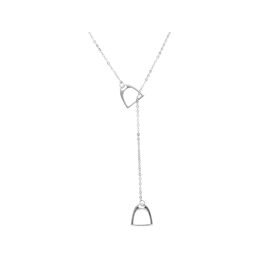 Silver necklace with two horse stirrup pendants on a white background