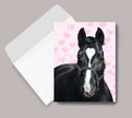 Thank You Card - Horse with Heart with a black horse illustration on a pink background with hearts, next to an envelope.