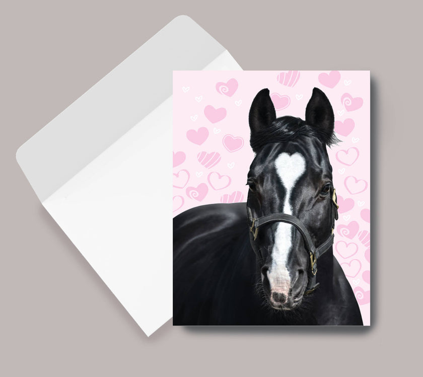 Thank You Card - Horse with Heart with a black horse illustration on a pink background with hearts, next to an envelope.