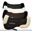 A collection of ThinLine Trifecta half pads with sheepskin rolls in black, brown, natural and white colors, designed to fit under saddles for horse riding.