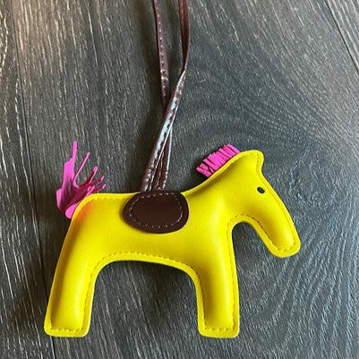 HorseHairz Equestrian Pony Purse/Bag Charm yellow with pink mane and tail, brown saddle with brown string.