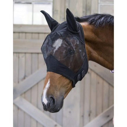 Horse in a stable wearing a black Defender® Comfort Fly Mask with Ears 