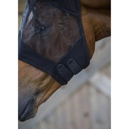 Horse wearing a black Defender® Comfort Fly Mask with Ears that shows the velcro closure detail