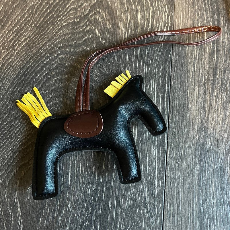 HorseHairz Equestrian Pony Purse/Bag Charm black with yellow mane and tail, brown saddle with brown string.