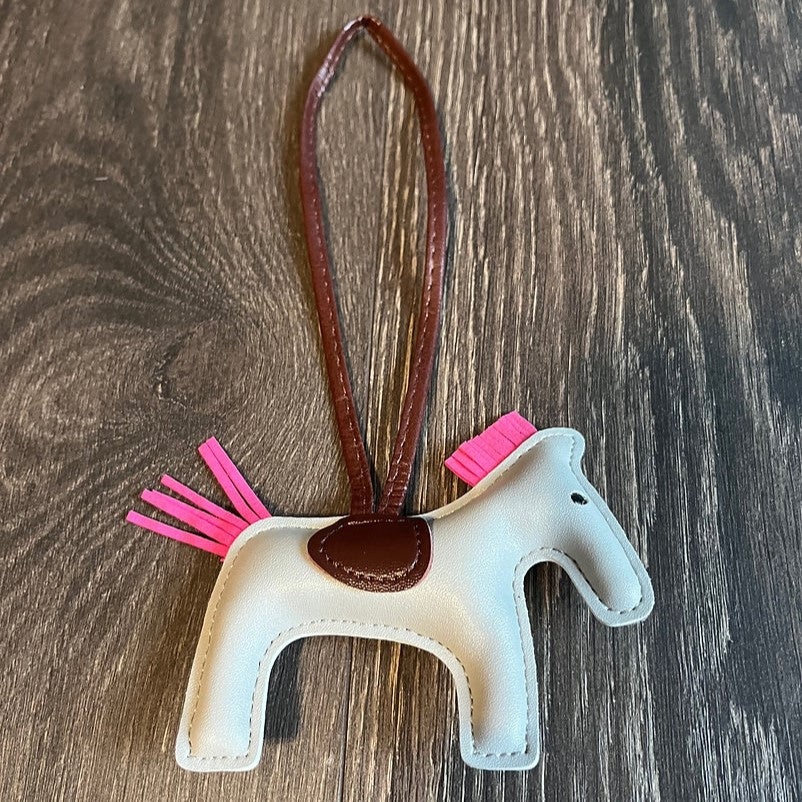HorseHairz Equestrian Pony Purse/Bag Charm silver with pink mane and tail, brown saddle with brown string.