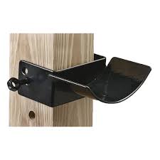 Black metal jump cup attached to a wooden post as example use