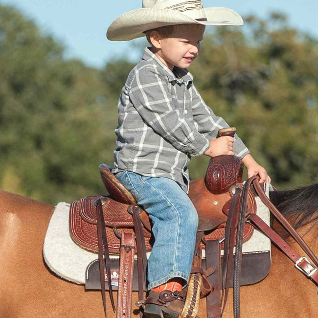 Kid Felt Pad showing example saddle and child rider using the felt pad.