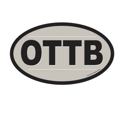 An oval-shaped vinyl sticker with the text 'OTTB' in bold letters, surrounded by a black border on a white background.